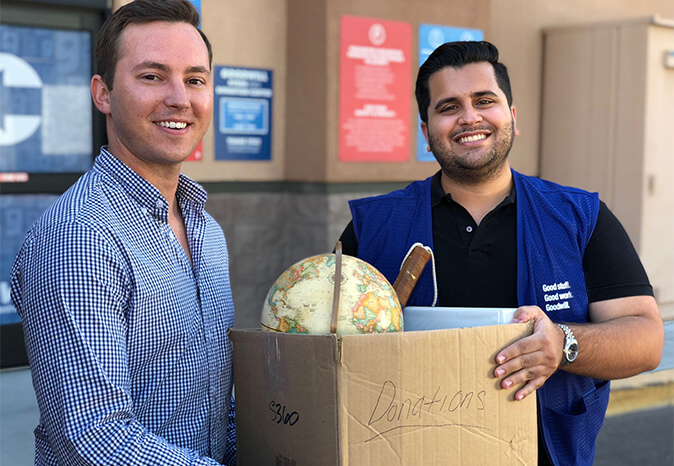 Goodwill AZ | Two men holding a donation box