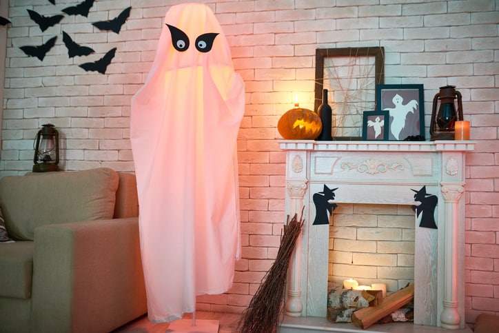 Goodwill AZ | White sheet dressed as a ghost in a house