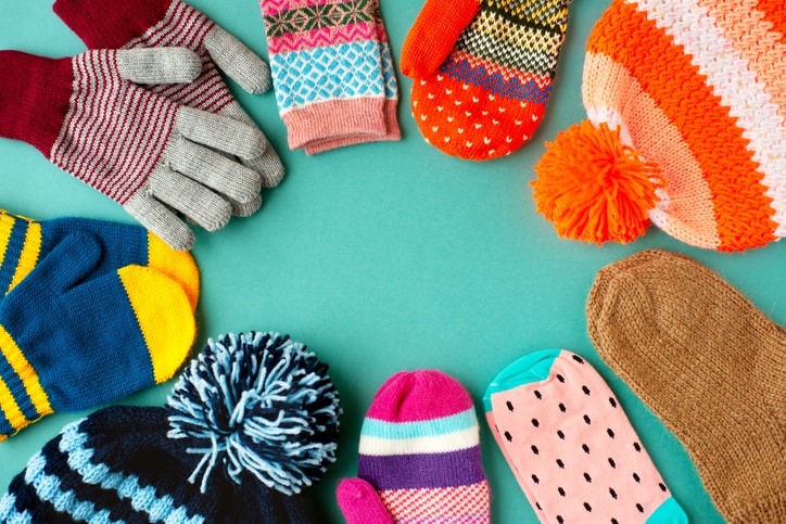 Goodwill AZ | gloves, socks, gloves, and mittens arranged in a circle