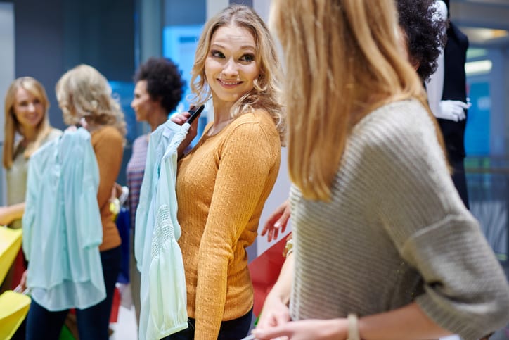 Goodwill AZ | Three women trying on clothes