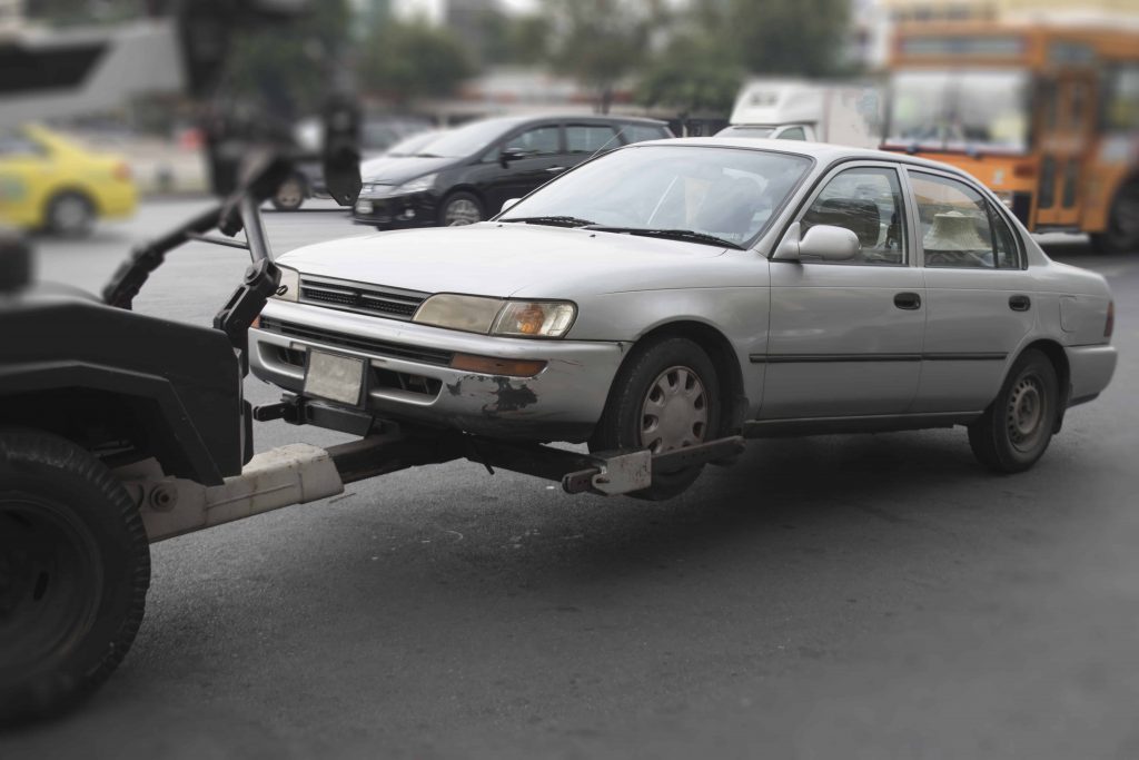 Goodwill AZ | Car hooked up to a trailer