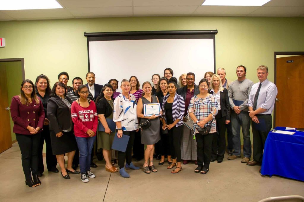 Goodwill AZ | Group of people standing in front of a room