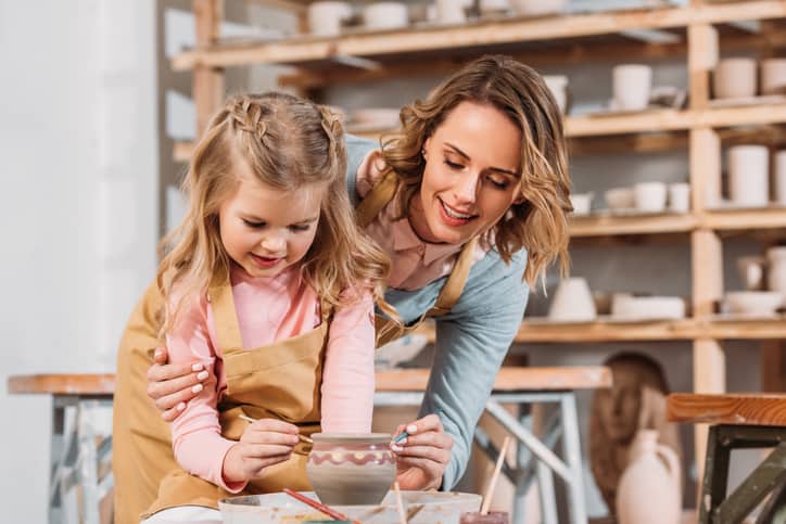 Goodwill AZ | Mother and daughter painting pottery