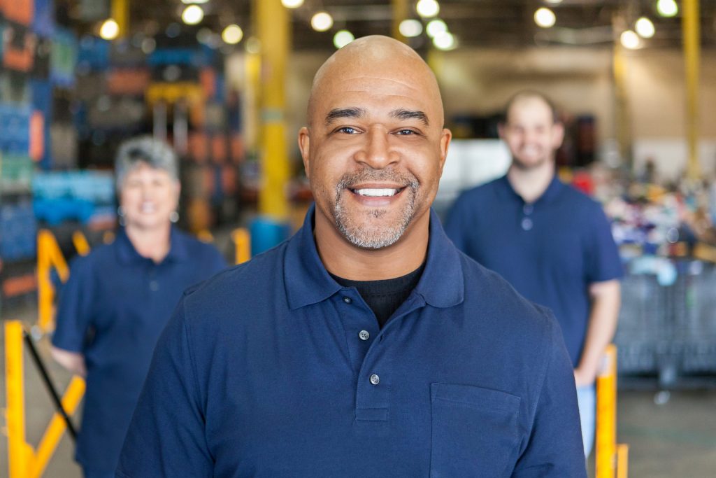 Goodwill AZ | man smiling wear blue polo