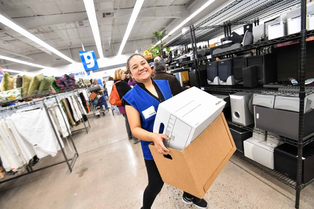 Goodwill AZ | Women carrying boxes ina store