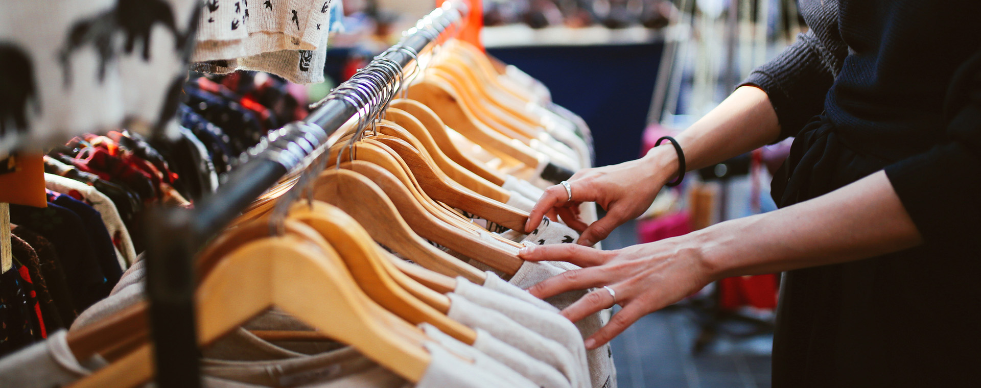 Goodwill AZ | someone looking at clothing on the rack