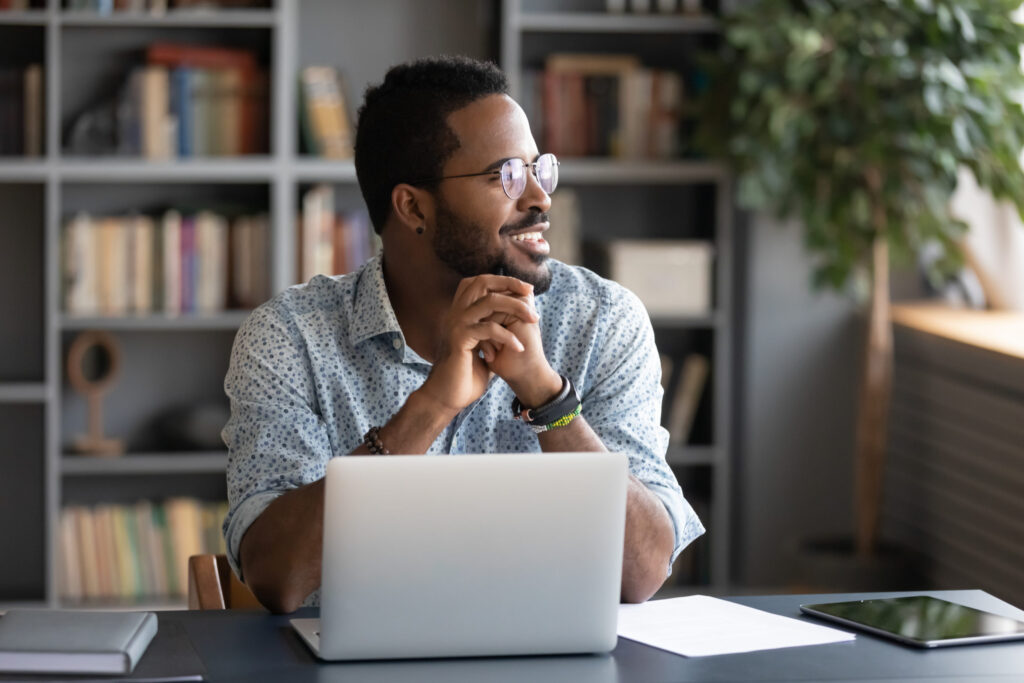 Man sitting at desk on a laptop